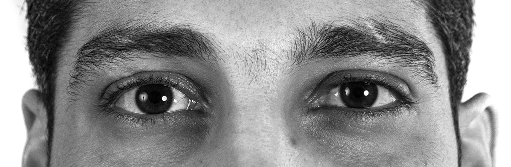 Black and white photo crop of man's eyes