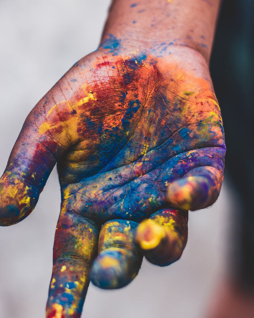 Hand covered in paint.